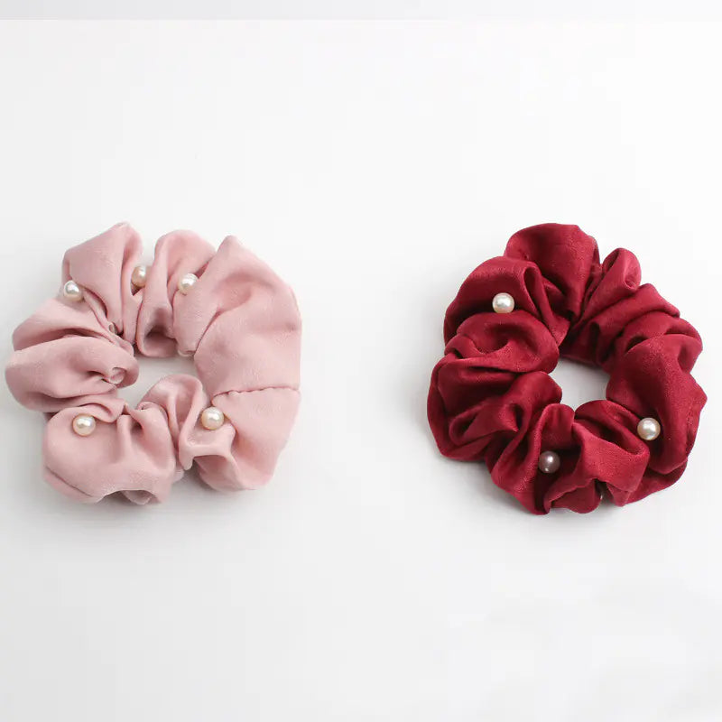 cloth hair accessories featuring pink and red scrunchies with pearls for stylish hair accessories.