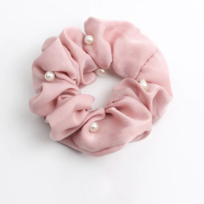 cloth hair accessories in soft pink with pearl accents for stylish hair styling.